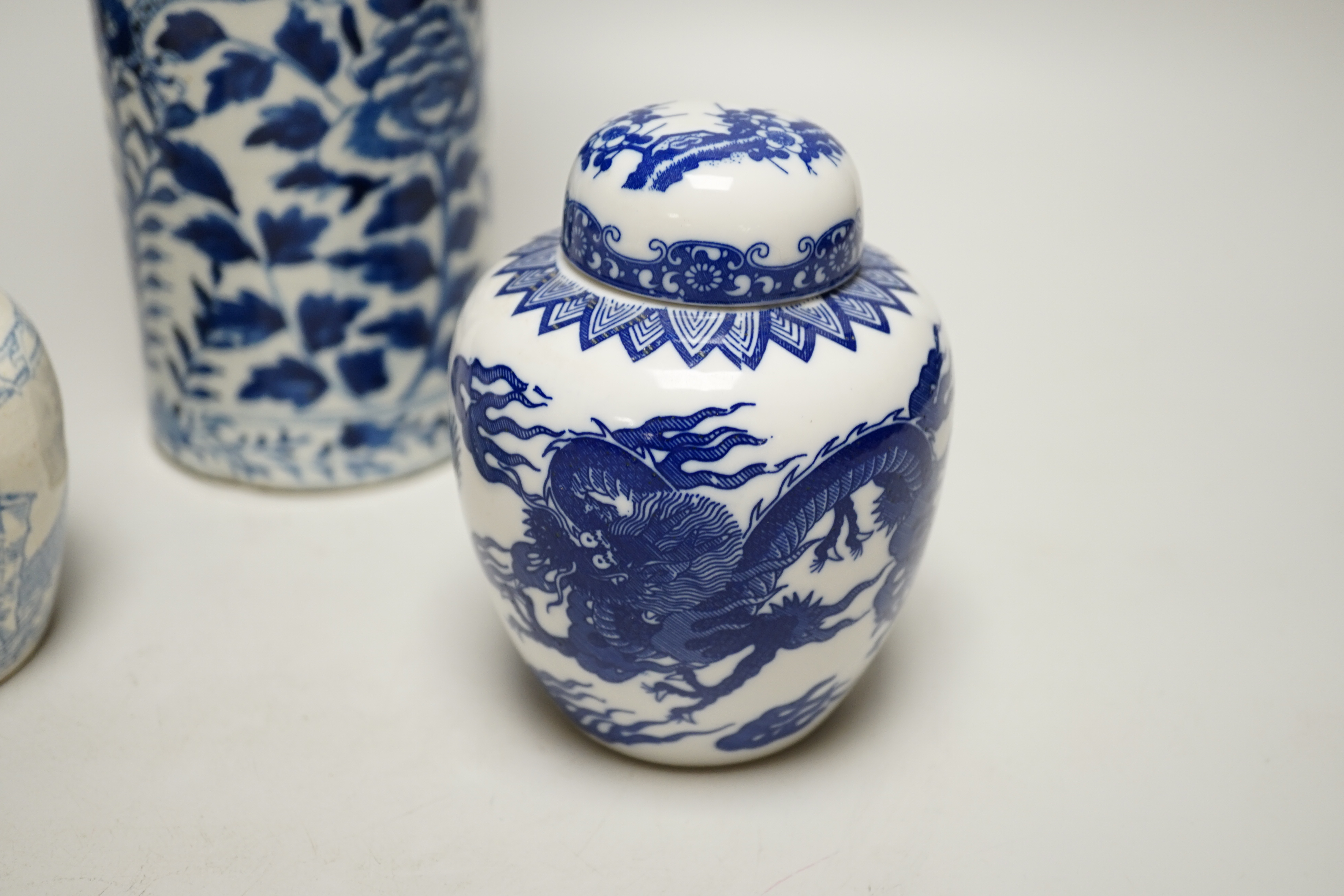 An early 20th century Chinese vase together with two small jars with covers, highest 31cm